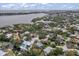 Aerial view of a neighborhood with homes nestled amongst lush greenery near the water at 1809 Buccaneer Ter, Sarasota, FL 34231