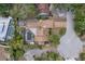 Aerial view showcasing a private pool, lush backyard, and the home's proximity to a cul-de-sac at 1809 Buccaneer Ter, Sarasota, FL 34231