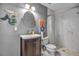 Updated bathroom showcases a marble tiled shower and classic vanity, offering a spa-like experience at 1809 Buccaneer Ter, Sarasota, FL 34231