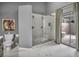 Updated bathroom features a glass-enclosed shower and access to outdoor patio at 1809 Buccaneer Ter, Sarasota, FL 34231