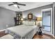 Comfortable bedroom with ceiling fan, and plush bedding, offering a peaceful retreat at 1809 Buccaneer Ter, Sarasota, FL 34231