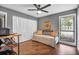 Bedroom has ample closet space, with a cozy daybed and sunlit window, versatile for any lifestyle at 1809 Buccaneer Ter, Sarasota, FL 34231