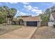 Well-maintained home with a spacious driveway, attached garage and manicured lawn creating curb appeal at 1809 Buccaneer Ter, Sarasota, FL 34231