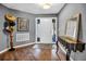 Well-lit foyer featuring hardwood floors, stylish decor, and a welcoming entryway at 1809 Buccaneer Ter, Sarasota, FL 34231