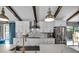 Modern kitchen featuring stainless steel appliances, marble countertops, and an undermount sink at 1809 Buccaneer Ter, Sarasota, FL 34231