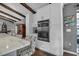 Modern kitchen features built-in stainless appliances, white cabinets, and sleek countertops, blending style and functionality at 1809 Buccaneer Ter, Sarasota, FL 34231