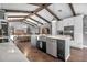 Kitchen with marble countertops, an island with a sink, stainless steel appliances, and an open layout at 1809 Buccaneer Ter, Sarasota, FL 34231