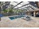 Enclosed pool area featuring a tile deck and ample space for lounge chairs at 1809 Buccaneer Ter, Sarasota, FL 34231
