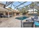 Screened pool area with outdoor seating and entertainment space at 1809 Buccaneer Ter, Sarasota, FL 34231