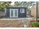 Backyard storage shed features double doors and a window at 1809 Buccaneer Ter, Sarasota, FL 34231