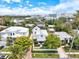 Aerial view of the community displaying the home, manicured landscaping, and nearby city skyline at 1841 Datura St, Sarasota, FL 34239