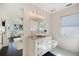 Elegant bathroom featuring granite countertop, vessel sink, and patterned tile floor at 1841 Datura St, Sarasota, FL 34239