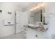 Bathroom featuring granite countertop, vessel sink, and modern fixtures at 1841 Datura St, Sarasota, FL 34239