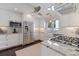 Well-lit kitchen with granite countertops, stainless steel appliances, and white cabinets for a modern look at 1841 Datura St, Sarasota, FL 34239