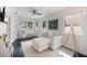 Bright living room with sofa, multiple windows, and ample natural light at 1841 Datura St, Sarasota, FL 34239