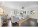Open-concept living space featuring hardwood floors, natural light, and tastefully coordinated decor at 1841 Datura St, Sarasota, FL 34239