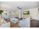 Bright living area with hardwood floors, light furnishings, and a view into other parts of the home at 1841 Datura St, Sarasota, FL 34239