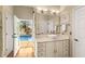Bright bathroom with vessel sink and direct access to the pool area at 1904 Nw 79Th St, Bradenton, FL 34209