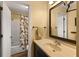 Bathroom featuring a single sink, a shower/tub combination, and access to the hallway at 1904 Nw 79Th St, Bradenton, FL 34209