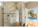 Walk-in shower featuring tiled walls with direct access to the pool at 1904 Nw 79Th St, Bradenton, FL 34209