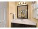 Well-lit bathroom featuring a granite countertop and a view into the hallway at 1904 Nw 79Th St, Bradenton, FL 34209