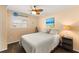 Cozy bedroom featuring nautical decor, a ceiling fan, and a comfortable queen-size bed at 1904 Nw 79Th St, Bradenton, FL 34209