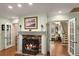 Close up view of fireplace with mantel and views to other rooms at 1904 Nw 79Th St, Bradenton, FL 34209