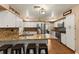 Well-lit kitchen featuring granite countertops, white cabinets and stainless steel appliances at 1904 Nw 79Th St, Bradenton, FL 34209