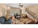 Inviting living room with stairs to the left, tile floors, and comfortable seating at 1904 Nw 79Th St, Bradenton, FL 34209