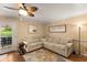 Relaxing living room with neutral furniture and a decorative ceiling fan at 1904 Nw 79Th St, Bradenton, FL 34209