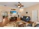 Spacious living room with staircase, view to the dining room and comfortable seating at 1904 Nw 79Th St, Bradenton, FL 34209