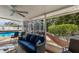 Inviting outdoor patio featuring comfortable seating, a ceiling fan, and views of the pool and backyard at 1904 Nw 79Th St, Bradenton, FL 34209