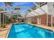 A beautiful screened-in pool and patio area is ideal for relaxing and entertaining friends and Gathering at 1904 Nw 79Th St, Bradenton, FL 34209