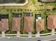 Overhead view of multiple homes with pools, tile roofs, and manicured landscaping at 20542 Trattoria Loop, Venice, FL 34293