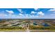 An aerial view showcases the community layout and access to lakes, pools, and more at 20542 Trattoria Loop, Venice, FL 34293