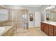 Bathroom featuring tile flooring, walk in shower, and a separate soaking tub at 20542 Trattoria Loop, Venice, FL 34293