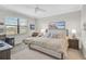 Relaxing main bedroom with a view of the pool deck and outdoor living space at 20542 Trattoria Loop, Venice, FL 34293