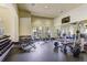 A well equipped gym with weights, mirrors, and televisions at 20542 Trattoria Loop, Venice, FL 34293