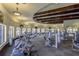 A large, sunny gym with an array of workout equipment and televisions at 20542 Trattoria Loop, Venice, FL 34293