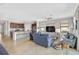 Spacious living room leading into kitchen with breakfast bar, ideal for seamless entertaining at 20542 Trattoria Loop, Venice, FL 34293