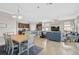 Open-concept living and dining room featuring tile flooring and natural light at 20542 Trattoria Loop, Venice, FL 34293