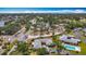 Expansive aerial view of the community featuring lush landscaping and a sparkling blue swimming pool at 2188 Corinne S Ct # A, St Petersburg, FL 33712