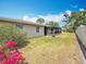 Private backyard featuring lush landscaping and a well-maintained lawn at 2188 Corinne S Ct # A, St Petersburg, FL 33712