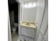 Bathroom features a vanity with a sink and storage, plus toilet and shower at 2188 Corinne S Ct # A, St Petersburg, FL 33712