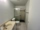 Bathroom with updated shower, toilet, and sink at 2188 Corinne S Ct # A, St Petersburg, FL 33712
