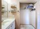 Bathroom showing sink, mirror, accessories, and closet area at 2188 Corinne S Ct # A, St Petersburg, FL 33712