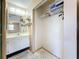 Bathroom featuring a vanity, mirror, and closet at 2188 Corinne S Ct # A, St Petersburg, FL 33712