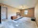 Bedroom featuring beige walls, a ceiling fan, a window, and a closet at 2188 Corinne S Ct # A, St Petersburg, FL 33712