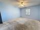 Bedroom featuring blue walls, a ceiling fan, and a window at 2188 Corinne S Ct # A, St Petersburg, FL 33712