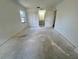 Bright bedroom with closet; view to bathroom with vanity and mirror at 2188 Corinne S Ct # A, St Petersburg, FL 33712